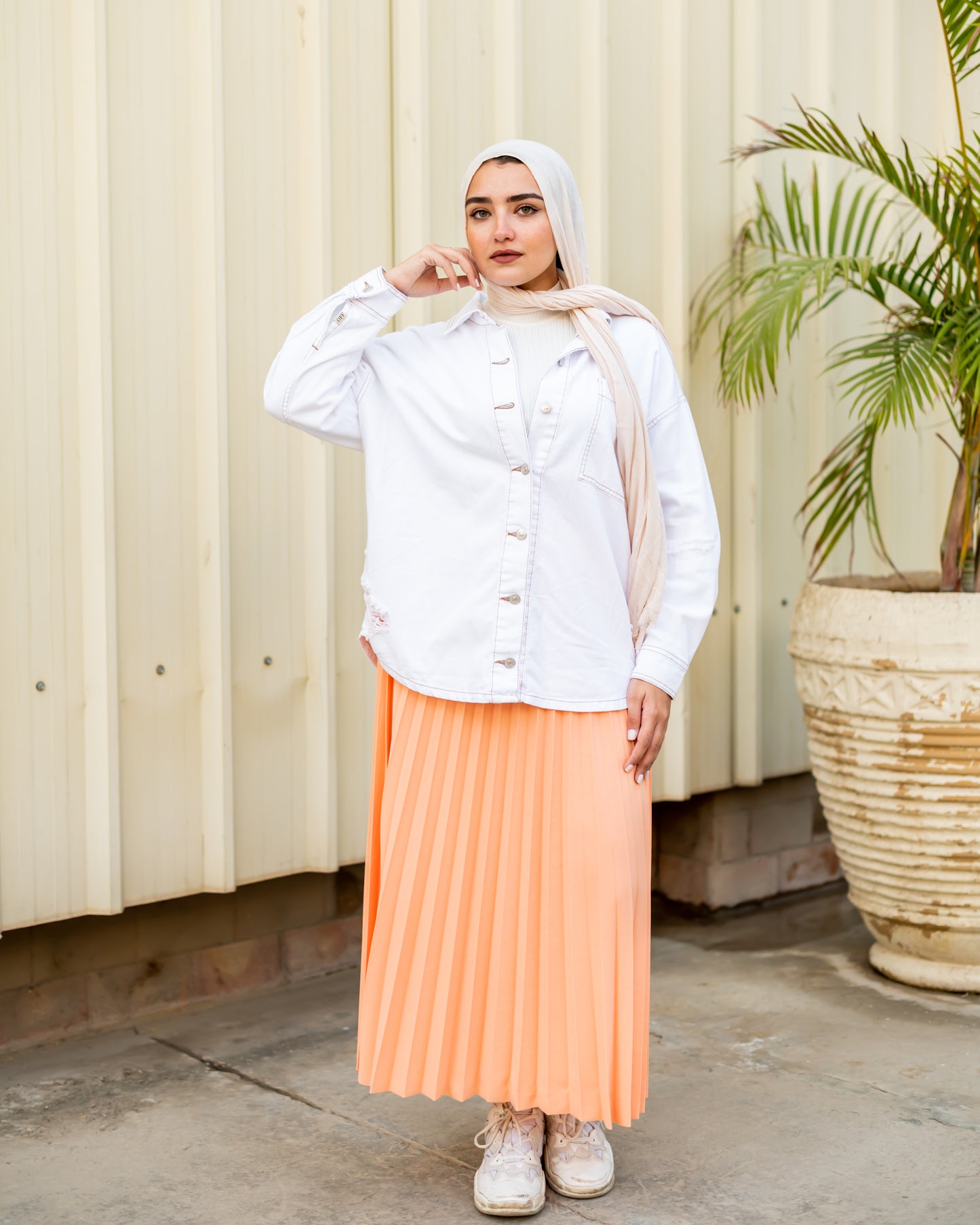 Pleated skirt in light orange