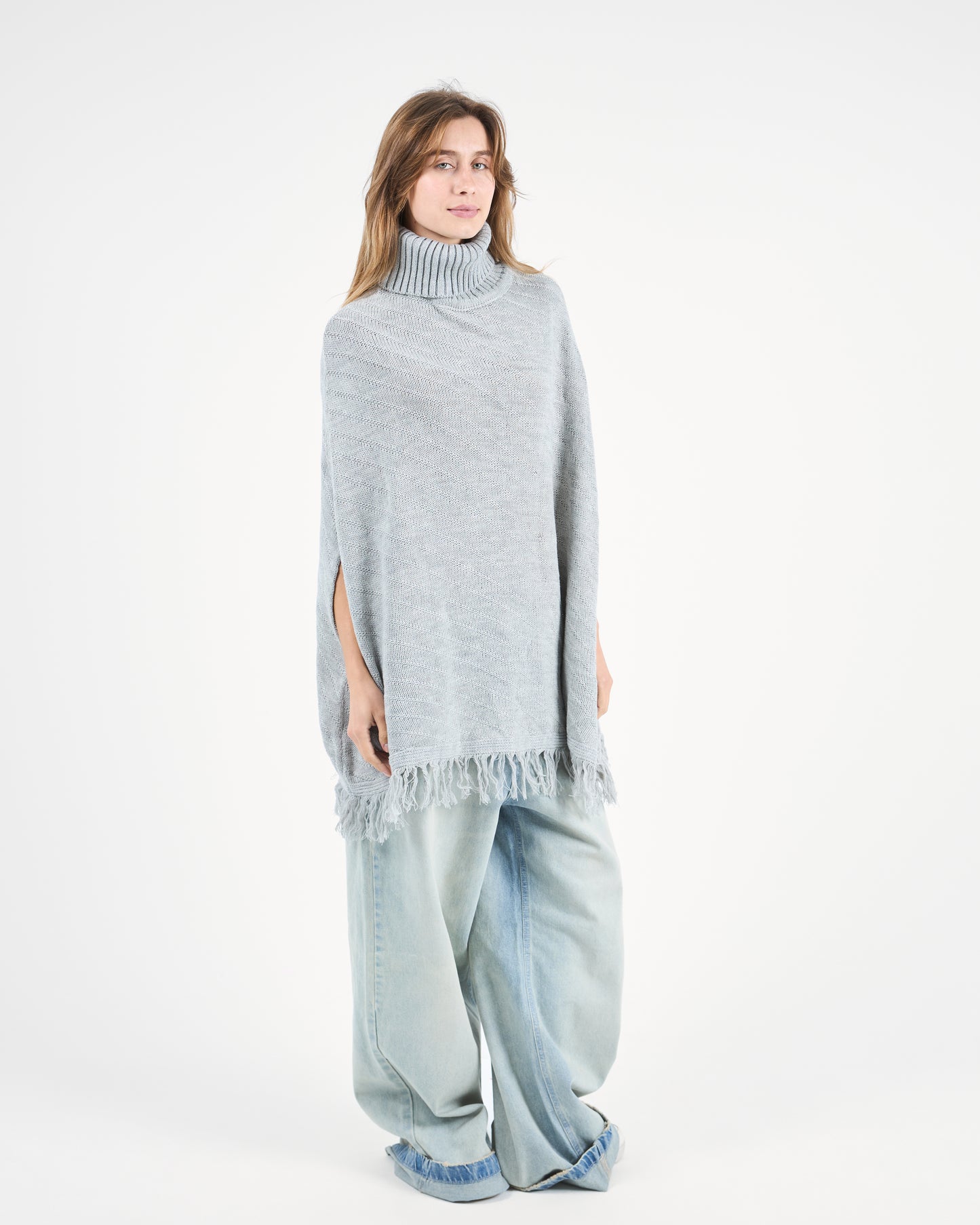 Grey Turtleneck Poncho With Fringe’s