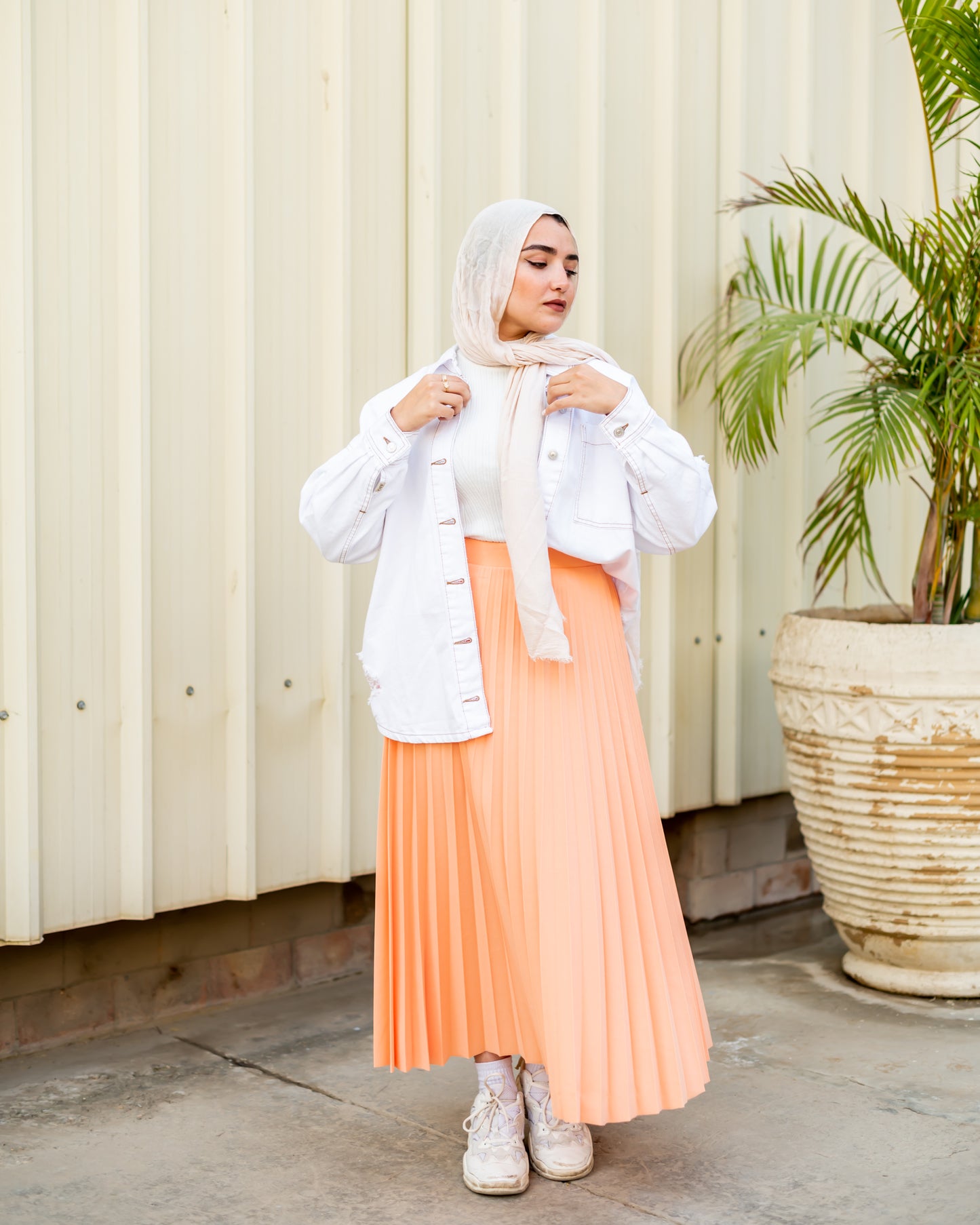 Pleated skirt in light orange
