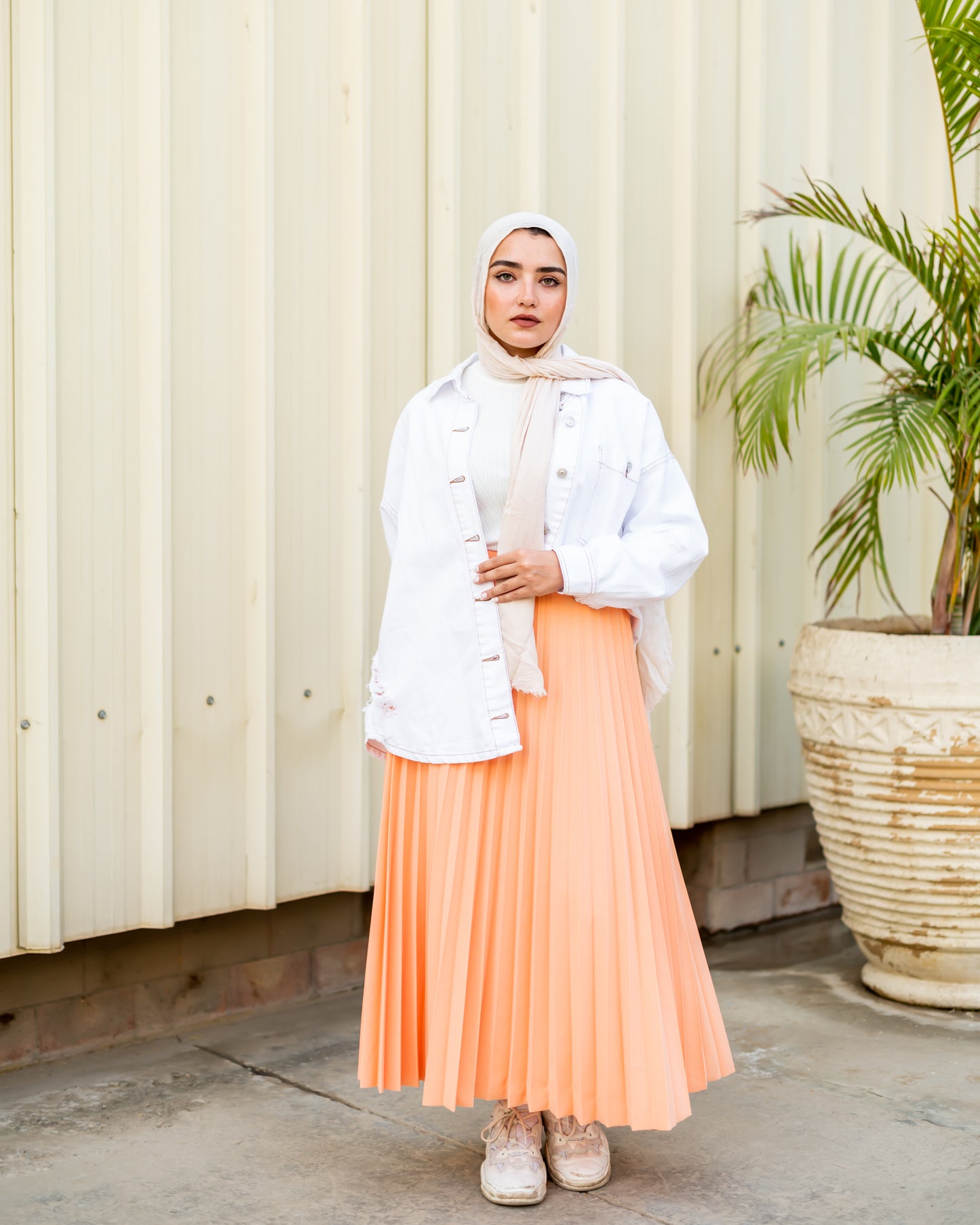 Pleated skirt in light orange