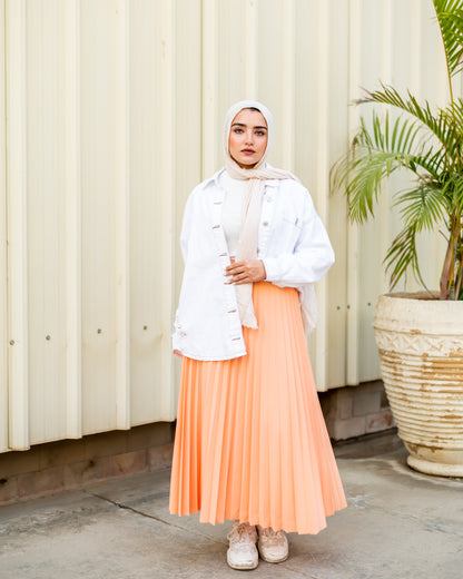 Pleated skirt in light orange